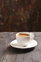 Espresso cup on the wooden table.