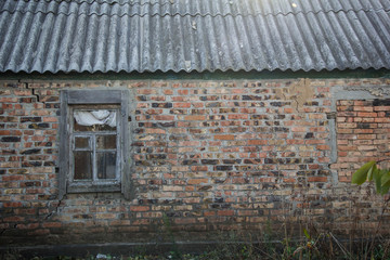 image of old window on red brick wall