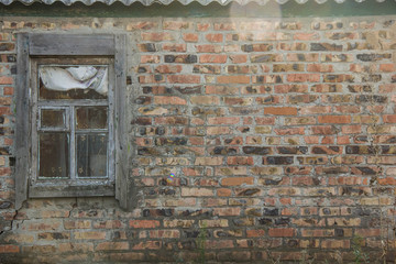 image of old window on red brick wall