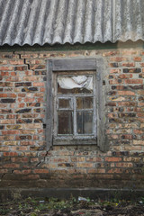 image of old window on red brick wall