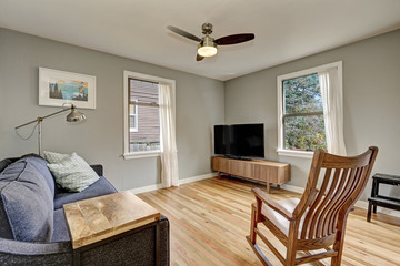 Simplistic living room interior with light hardwood floors