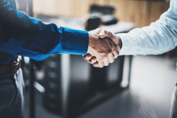 Business partnership handshake concept.Closeup photo of two businessmans handshaking...