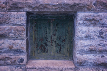 Green grunge door in wall