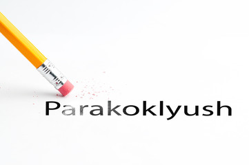 Closeup of pencil eraser and black parakoklyush text. Parakoklyush. Pencil with eraser.