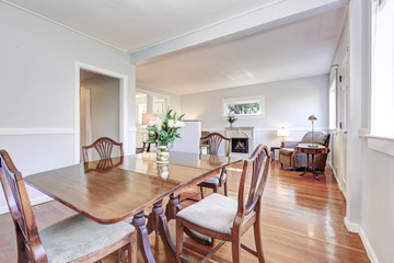 Dining room and living room interior with carved wooden furniture