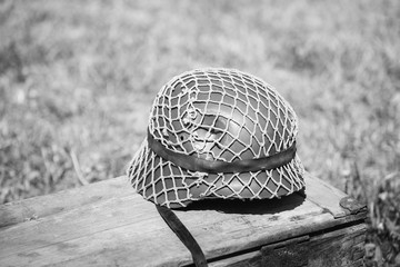 Metal Helmet Of Infantry Soldier Of Wehrmacht, Nazi Germany Of World War II On Old Wooden Box