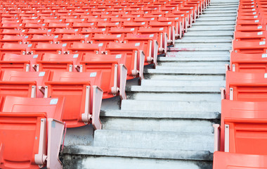 Empty orange seats at stadium,Rows of seat on a soccer stadium