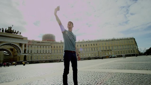 Guy doing selfie in Palace Square