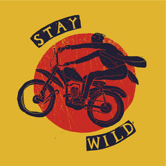 stay wild mad motorcycle  rider print. red and yellow and blue handwriting.