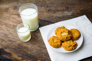 whole wheat almond cookies with a glass of milk.