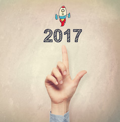 Hand pointing to 2017 concept