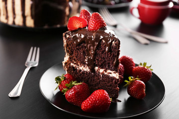 Piece of cake with strawberry on plate