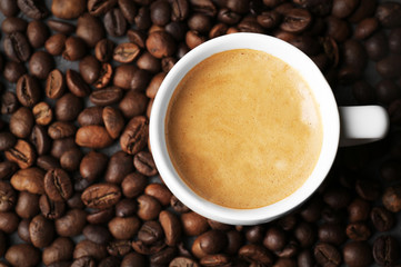 Roasted coffee beans with cup