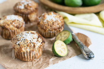Feijoa muffins topped with shredded coconut in light composition