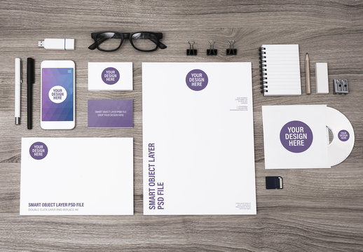 Smartphone, Tablet, and Stationery on Light Wooden Desk Mockup 3