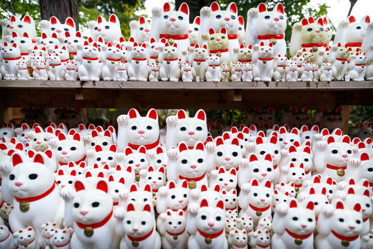Multiple Maneki-Neko statues at Gotoku-ji temple near Tokyo