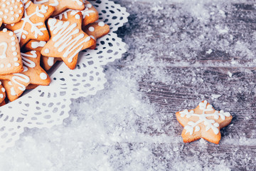 Christmas composition with gingerbread on wooden background
