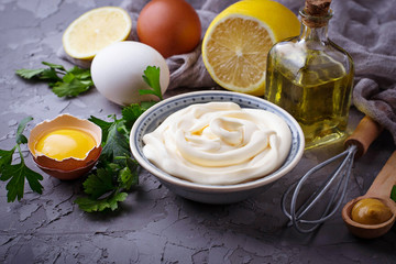Homemade mayonnaise sauce and olive oil, eggs, mustard, lemon