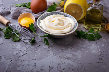 Homemade mayonnaise sauce and olive oil, eggs, mustard, lemon