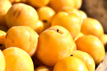 Fresh organic plums on street market stall
