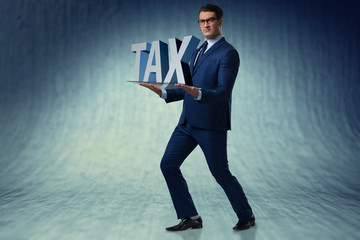 Businessman struggling with high taxes