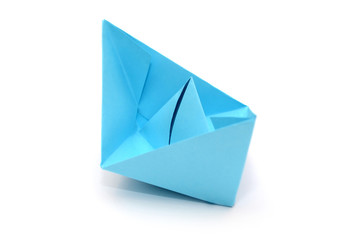 Blue paper boat, origami isolated on white