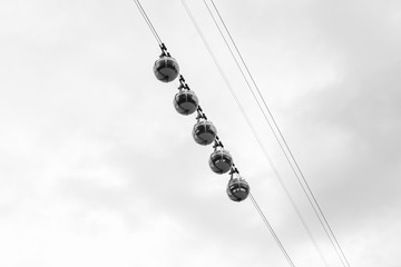 transparent cable cars that links the Bastille with the city cen