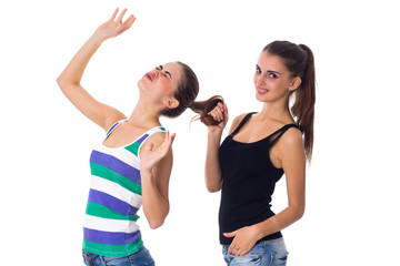 Young woman holding another woman's hair