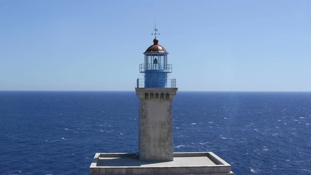 Blue sea horizon with lighthouse
