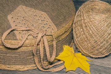 Box covered with fabric and a ball of twine with maple leaf
