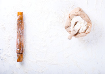 Flour the Board and rolling pin.Ingredients for baking.selective focus.Top view. Copy space.