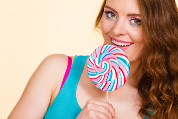 Woman joyful girl with lollipop candy