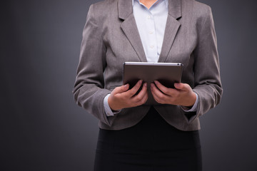 Woman with tablet computer in business concept