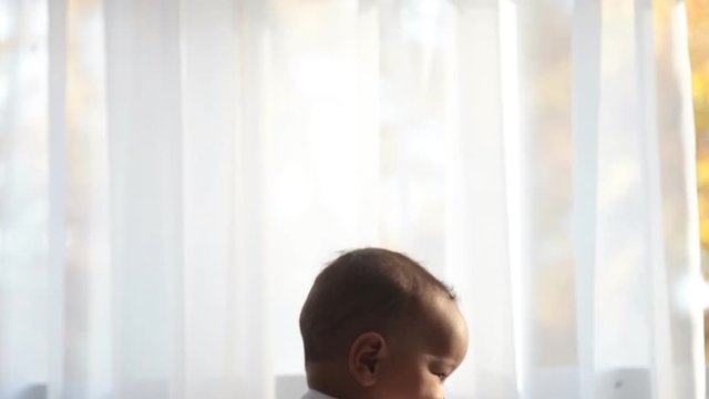 Father holding a child in her arms