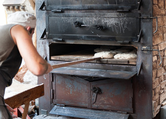 introducing artisan baker dough in the oven