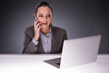 Businesswoman with laptop in business concept