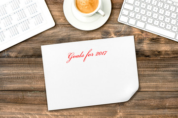 Digital tablet with calendar Resolutions Goals 2017 Office desk