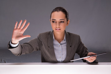 Woman with tablet computer in business concept