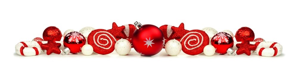 Christmas border of red and white ornaments and decor isolated on a white background