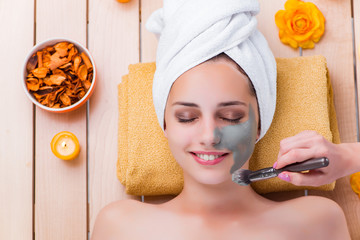 Young woman in spa health concept 