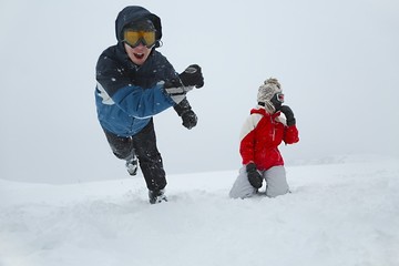 Fototapeta na wymiar Skiers playing in the snow