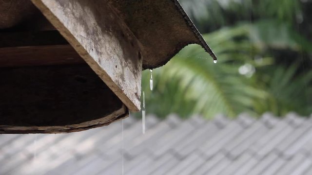 rain flows down from a roof down,in Thailand