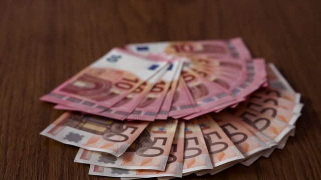 Scattered Many Euro on Table. Slow motion