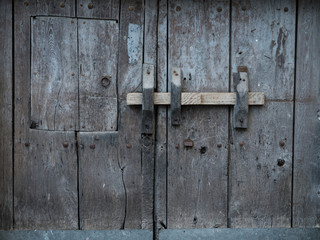 Rustic and old wooden gate close-up