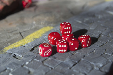 a lot of red dice on a craps table