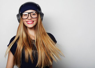 Woman with headphones listening music. 