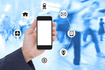 Businessman Hand holding blank screen mobile phone with blurred image of crowd