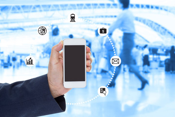 Businessman Hand holding blank screen mobile phone with blurred image of crowd background