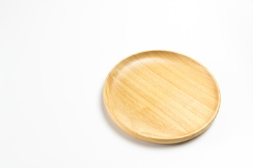Wooden plate or tray isolated on white background