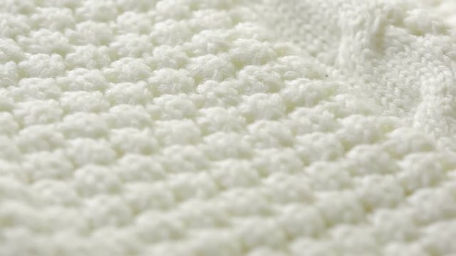 white knitted wool texture. use as background. close-up